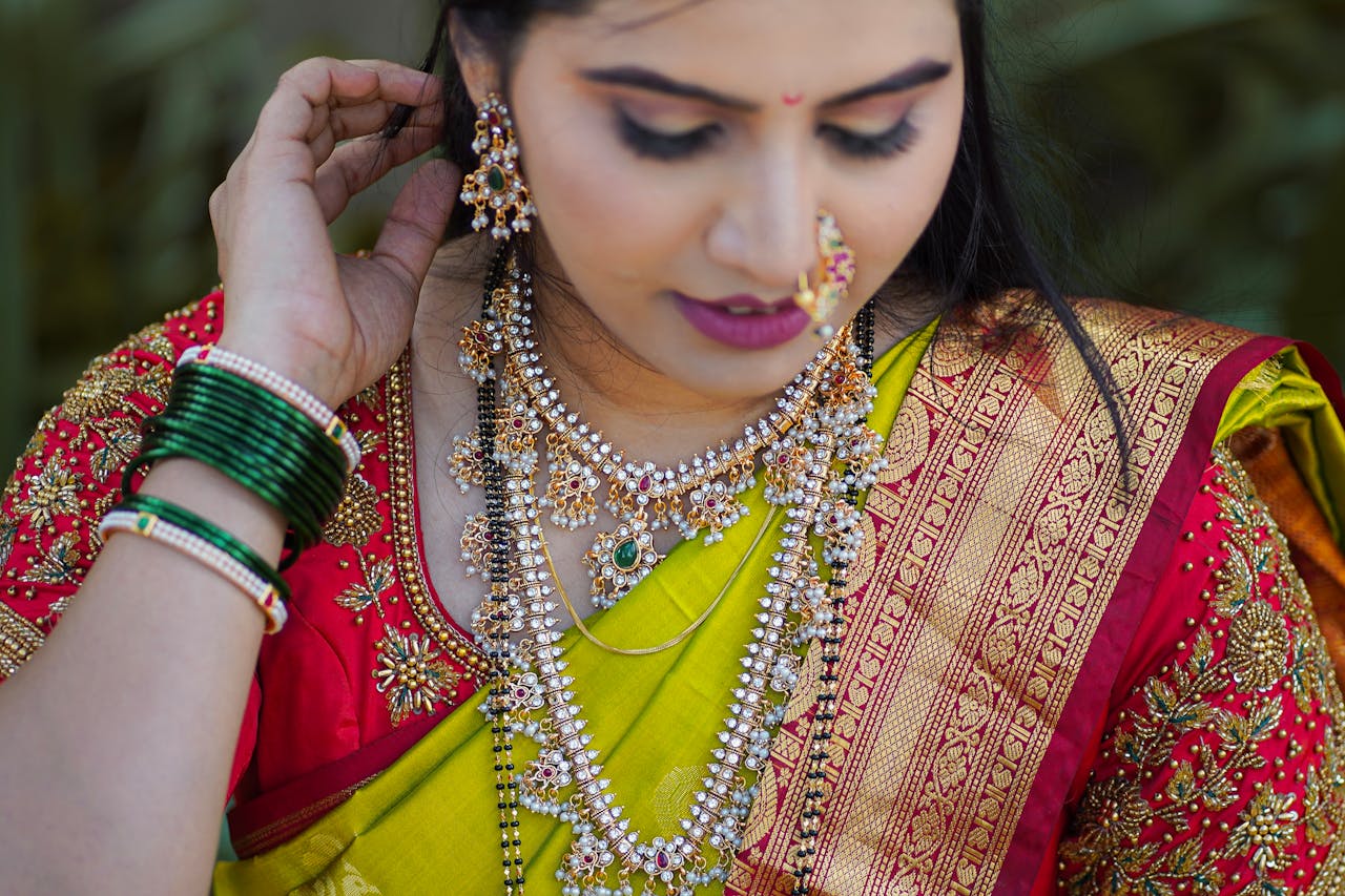 Close-up of a woman in traditional Indian bridal attire with elaborate jewelry.